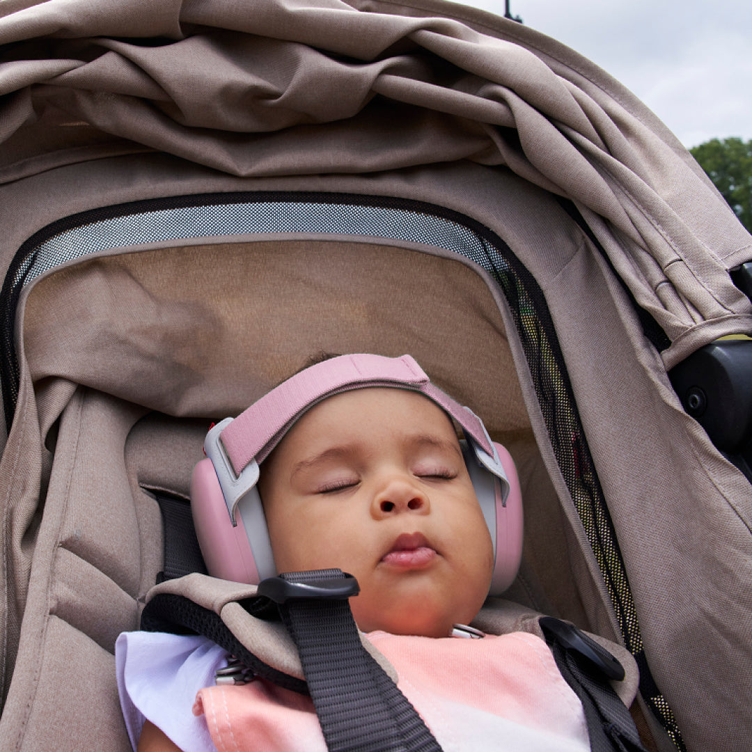 Baby sleeping while wearing muffy baby in rose-pink