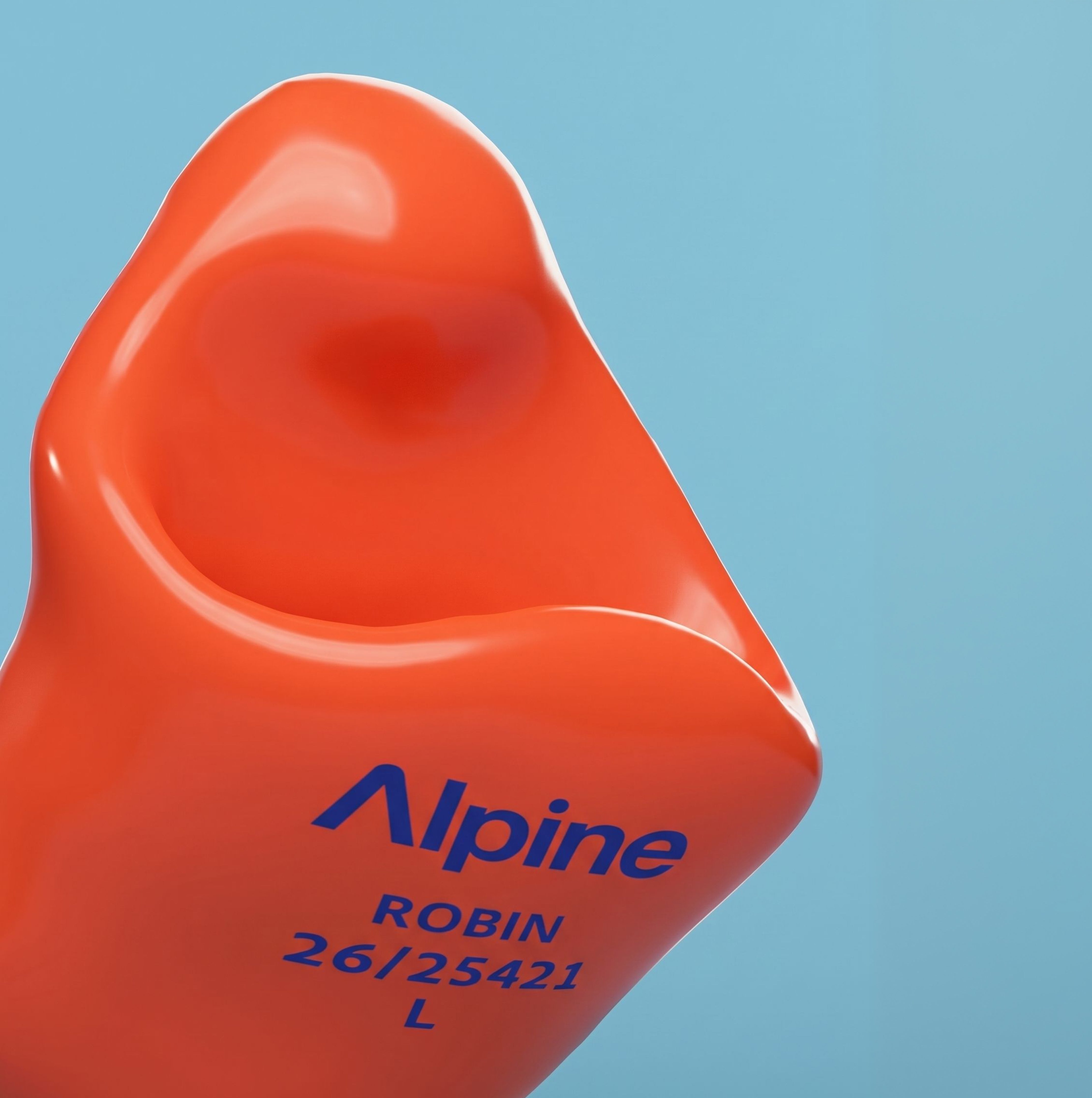 Close-up of an Alpine SleepSoft Custom Orange earplug with the engraving &