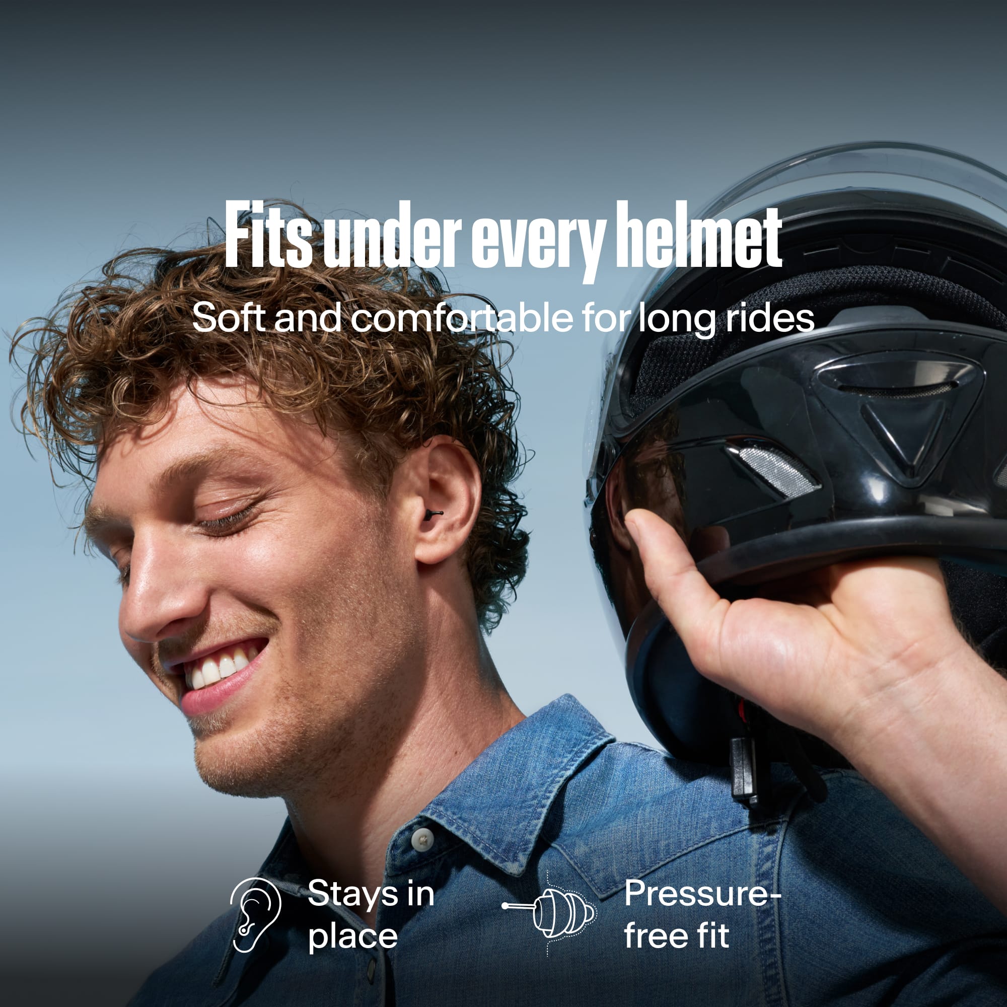 Smiling man holding a helmet, wearing Alpine MotoSafe Duo earplugs, with the text &
