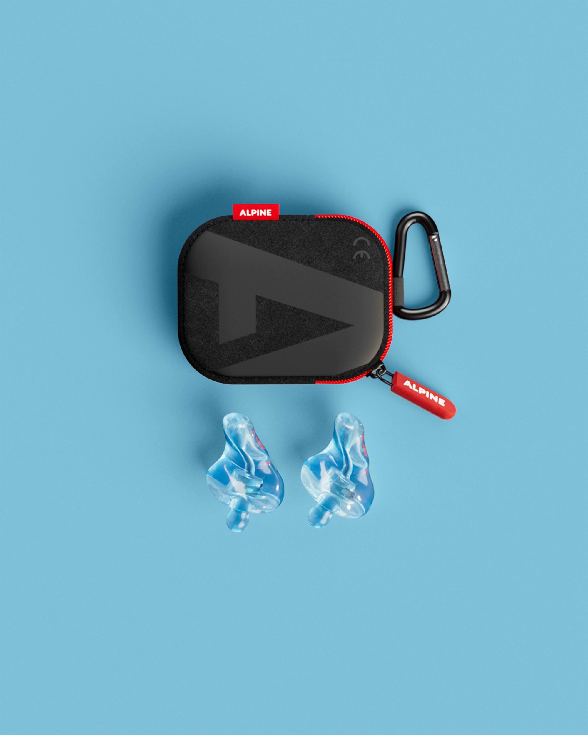 Alpine MotoSafe Custom Transparent Blue earplugs with black carrying case, top view 