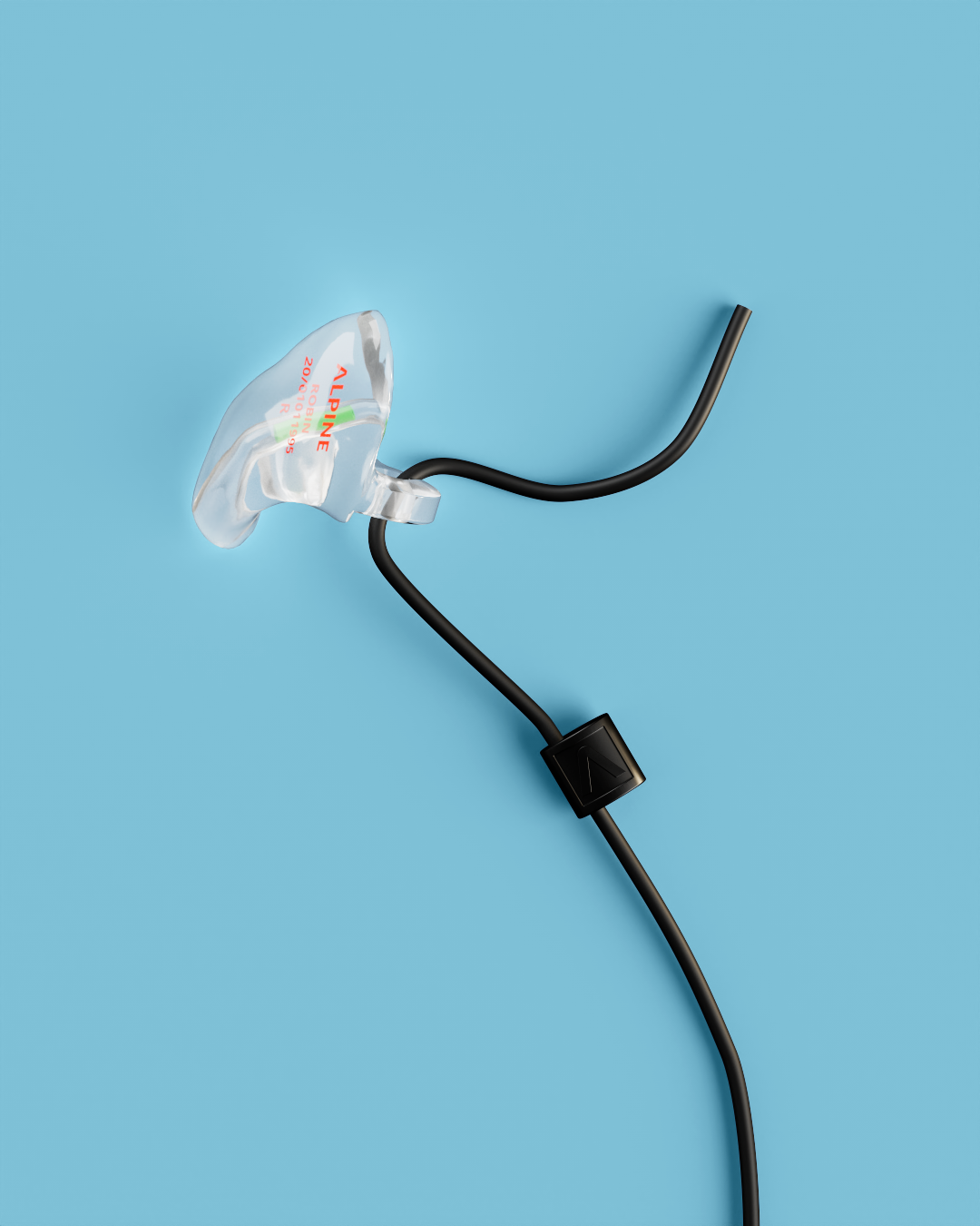 Close-up of a single Alpine WorkSafe Custom Transparent earplug attached to a black cord 