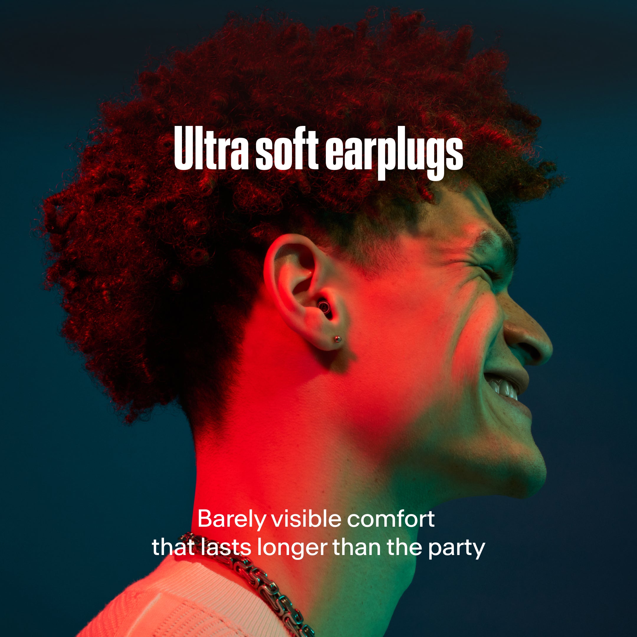 Man wearing Alpine ultra soft earplug; barely visible comfort that lasts longer than the party 